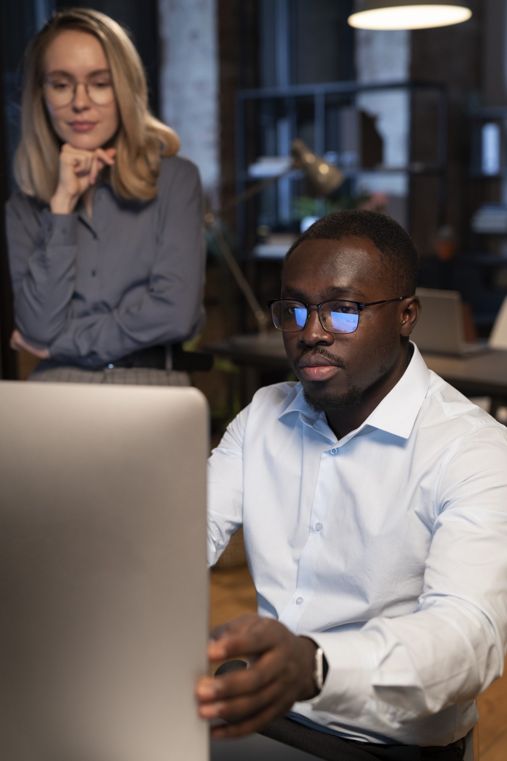 coworkers-looking-monitor
